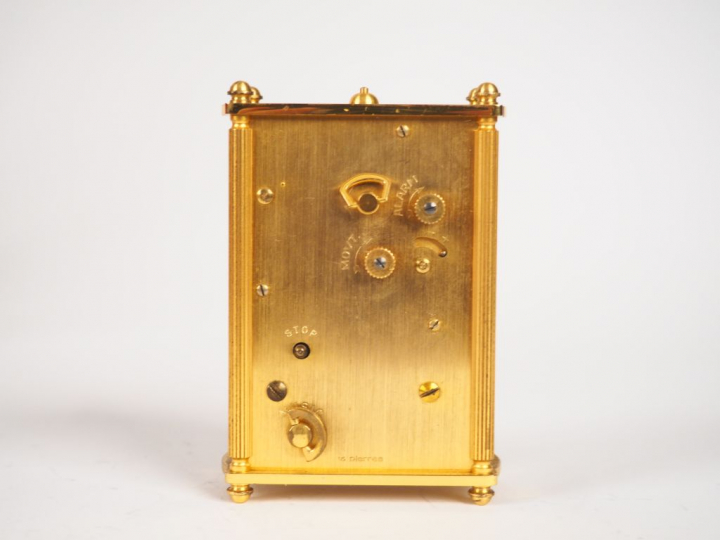 JEAGER LECOULTRE. Réveil de voyage dans son étui en cuir. Dim. 9,2 x 6