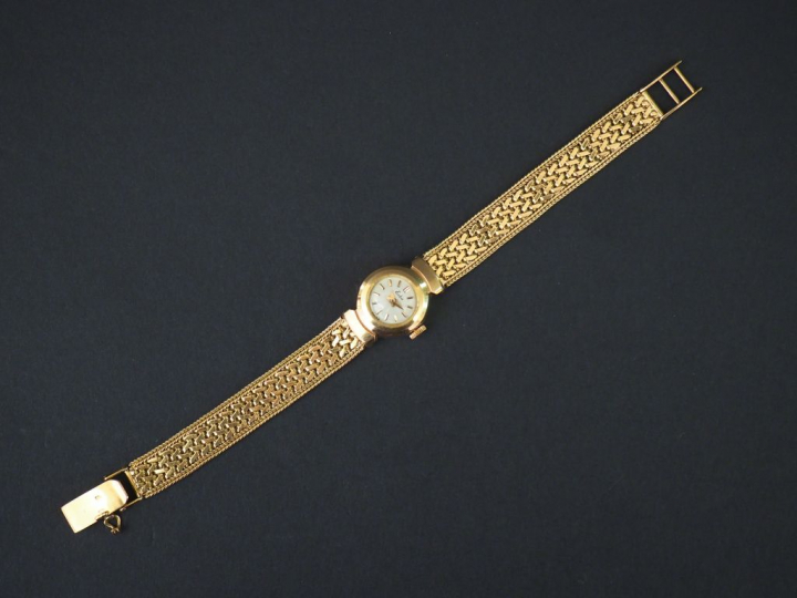 ESKA Montre bracelet de dame, boitier et bracelet en or jaune. Cadran 