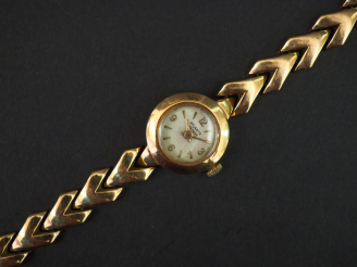 Vente aux enchères 	ATLANTA à Genève  Montre bracelet de dame, boitier et bracelet en or 
