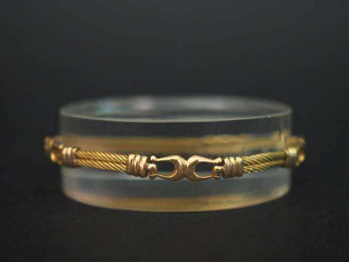 Bracelet articulé en or jaune, à décor d’étriers alternés de maillons 