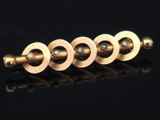 Vente aux enchères Broche barrette en or jaune, à décor de cercles entourant une tige cen