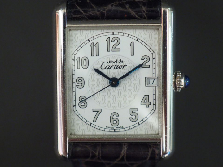 CARTIER, Must Montre bracelet tank en argent. Cadran rectangulaire à f