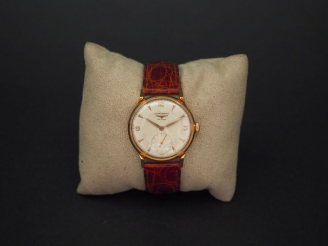 Vente aux enchères LONGINES. Montre bracelet d'homme.  Boitier en or. Bracelet cuir, bouc