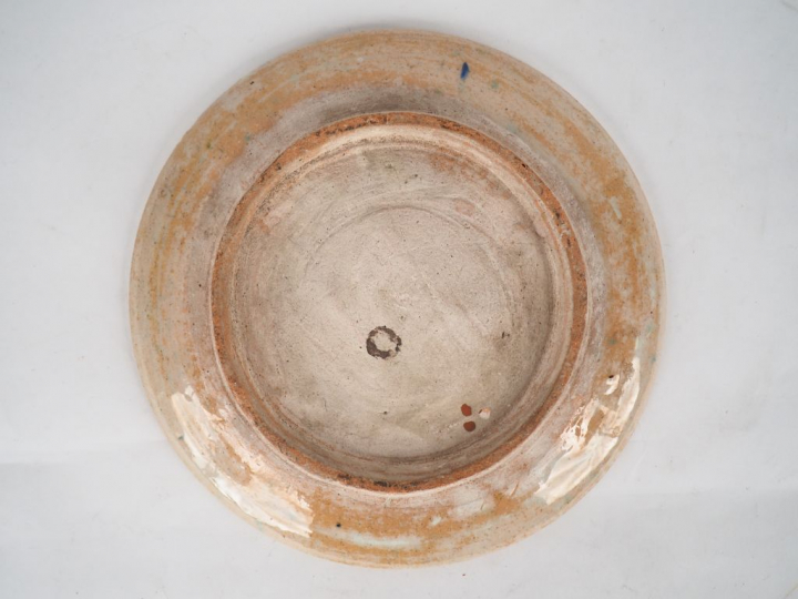 Assiette XIXème en céramique d'Iznik. Diam. 25 cm  (retrait de matière