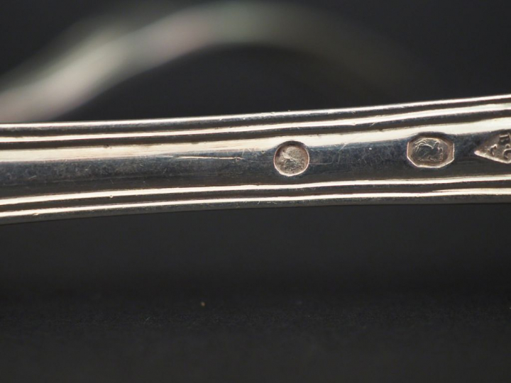 Ensemble comprenant :  - deux grands couverts Restauration en argent, 