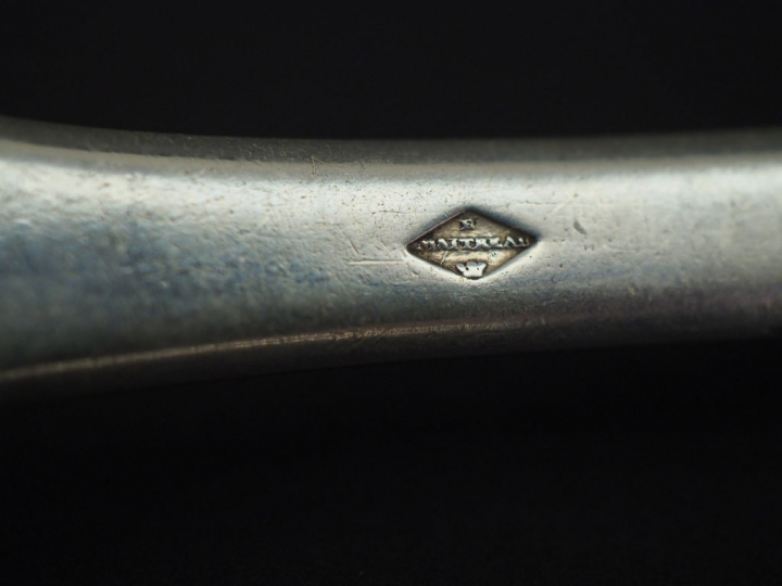 Ensemble comprenant :  - deux grands couverts en argent, poinçon Miner