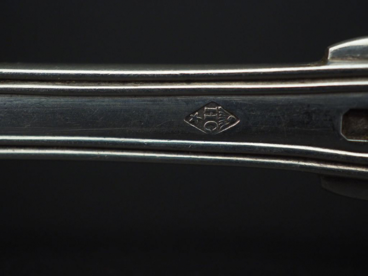 Ensemble comprenant :  - trois grands couverts en argent, poinçon Mine