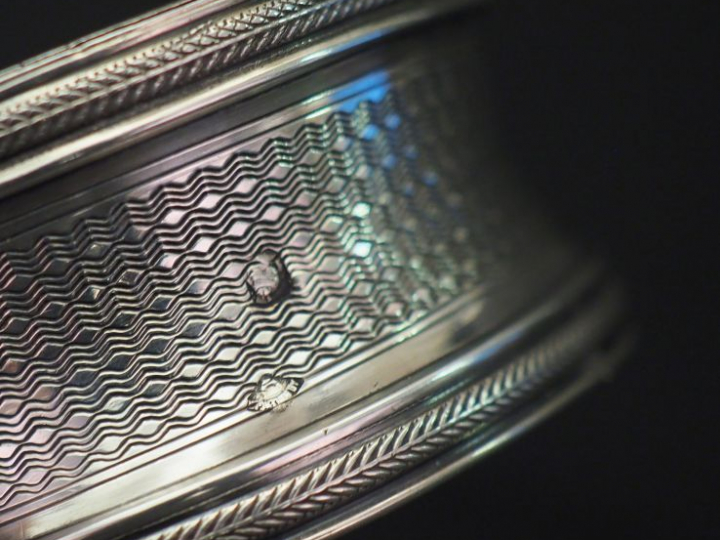 Ensemble comprenant :  - un rond de serviette en argent, poinçon Miner