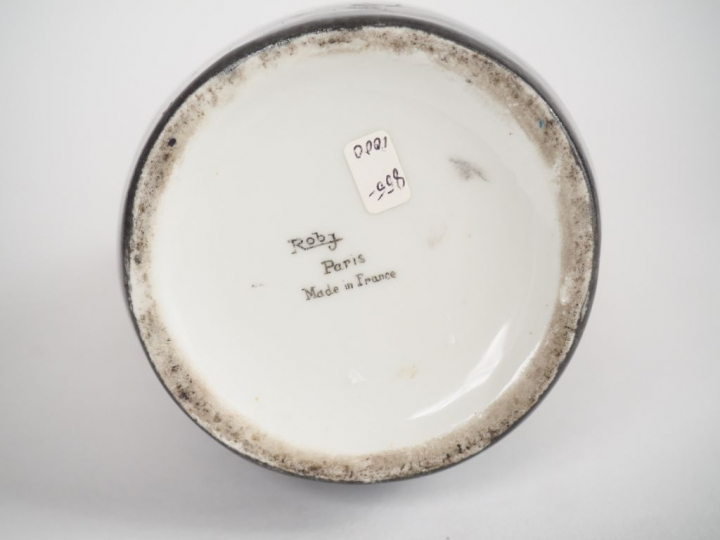 ROBJ.  Bouteille à liqueur en porcelaine polychrome "Napoléon". Signée