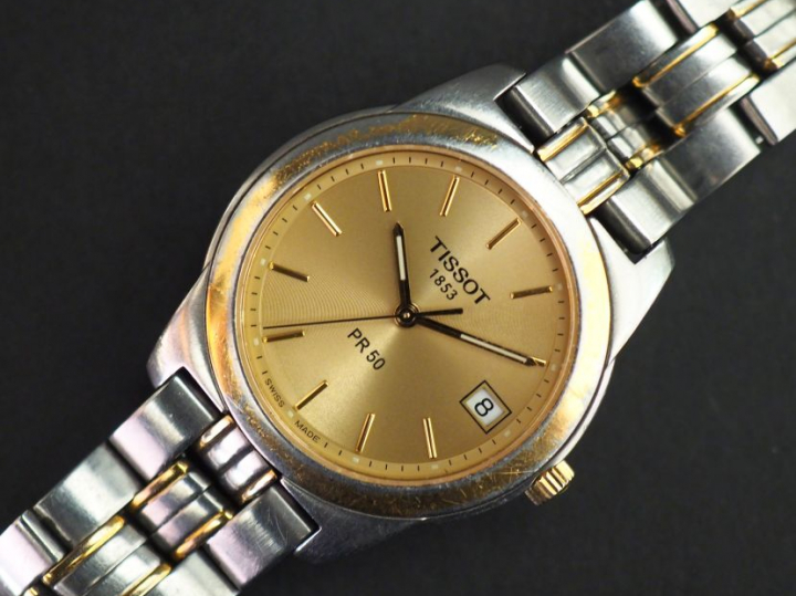 TISSOT, 1853. PR50 Montre bracelet en acier et métal doré.  Cadran ron