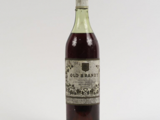 Vente aux enchères 1 VIEILLE BOUTEILLE OLD BRANDY NOËL SALLES - CAPSULE LÉGER ABIMÉE