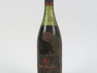 Vente aux enchères 1 BOUTEILLE VIN D'ALGÉRIE SIDI BRAHIM ANDRÉ VIGNA - 1942 - 6,5 CM/BS