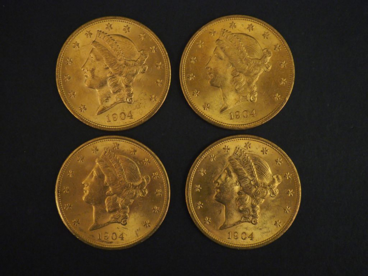 Quatre pièces de 20 Dollars or, 1904.  FRAIS ACHETEURS 5% TTC.