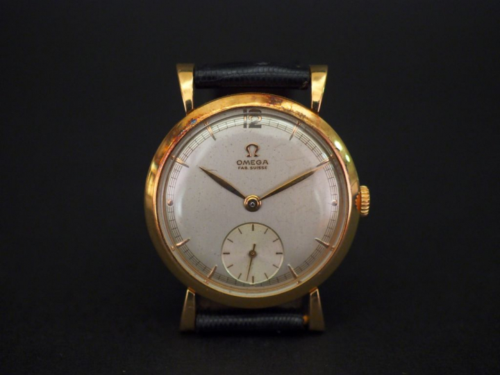 OMEGA Montre bracelet d'homme, boitier en or jaune. Cadran rond à inde