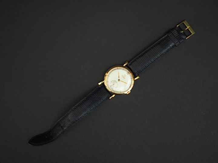 OMEGA Montre bracelet d'homme, boitier en or jaune. Cadran rond à inde
