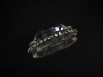 Vente aux enchères Bracelet articulé en or blanc, serti de diamants taille ancienne et de