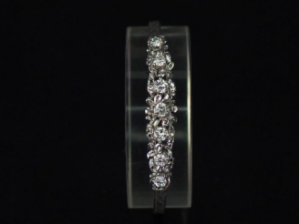 Vente aux enchères Bracelet en argent, maille plate à décor de motifs géométriques, et or