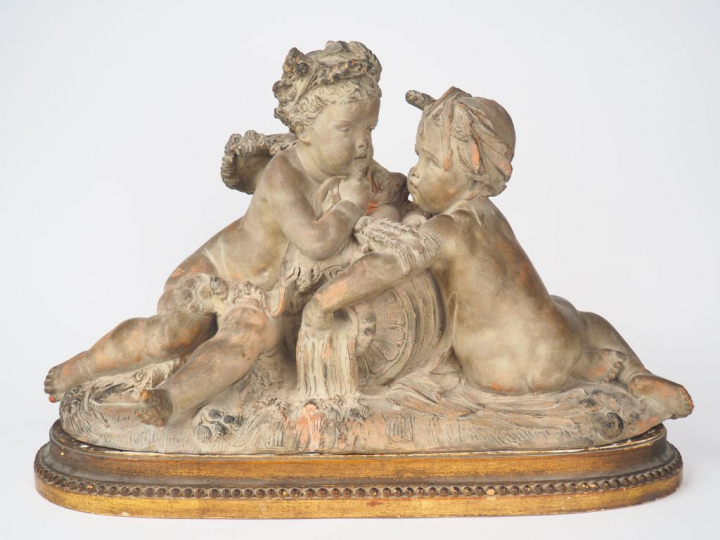 A CARRIER.   "La source" Groupe en terre cuite à patine claire. Signé 