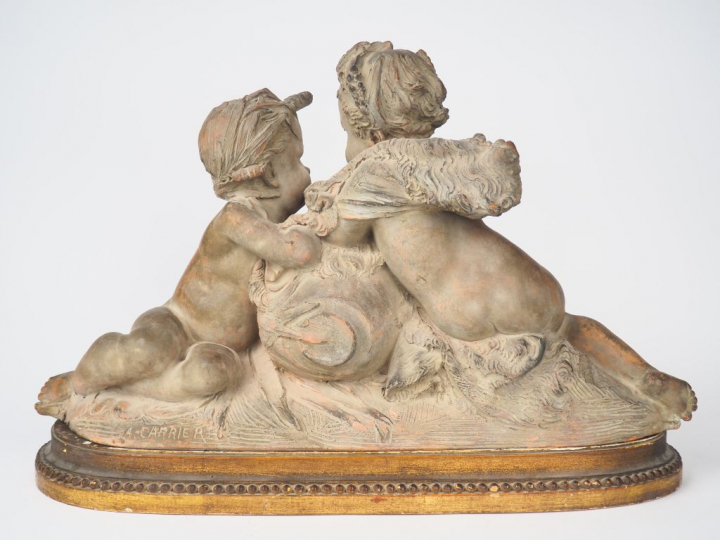 A CARRIER.   "La source" Groupe en terre cuite à patine claire. Signé 