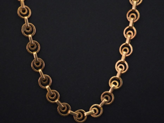 Vente aux enchères Collier souple en or jaune, à décor de disques ajourés. Long. 56 1/2 P