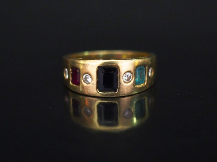 Bague jonc en or jaune 750, sertie de diamants et pierres de couleur e