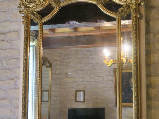 Grande glace Napoléon III en bois et stuc doré mouluré et sculpté, à d