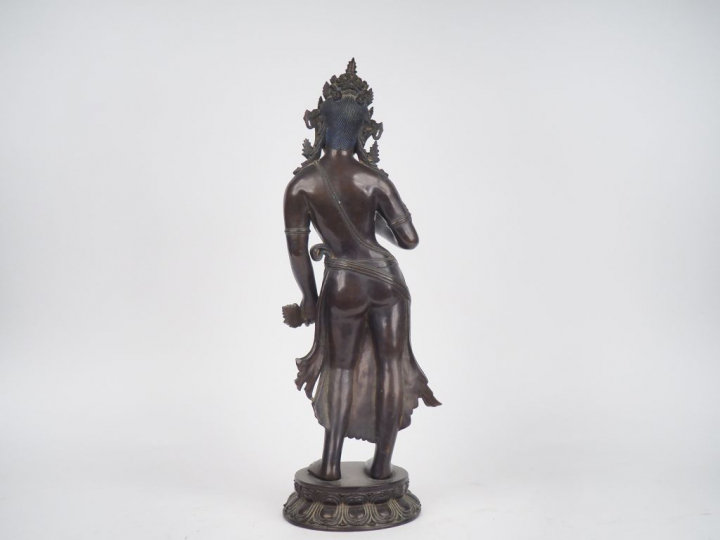 Tibet, début XXe siècle, Boddhisattva en bronze de patine brune et dor