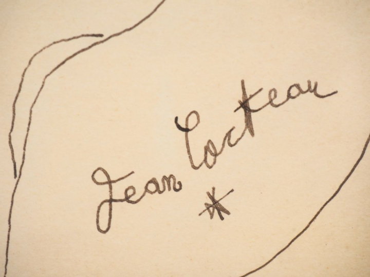 Jean COCTEAU. Dessin au feutre sur un menu. Signé en bas à droite. Dim
