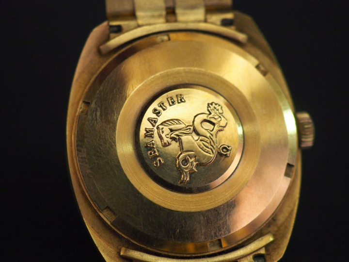 OMEGA. Montre or "Seamaster", bracelet tank en or. Poids tel : 103 g  