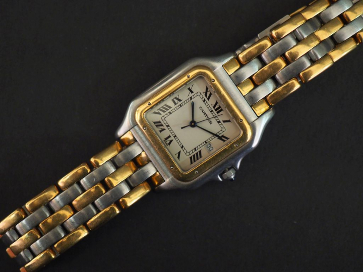 CARTIER.  Montre "Panthère", boîtier et bracelet en or jaune et acier.