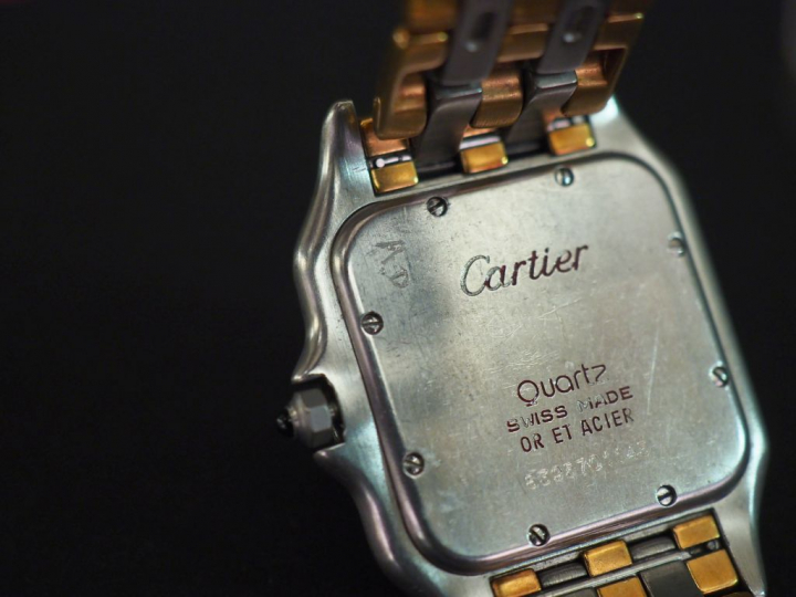 CARTIER.  Montre "Panthère", boîtier et bracelet en or jaune et acier.