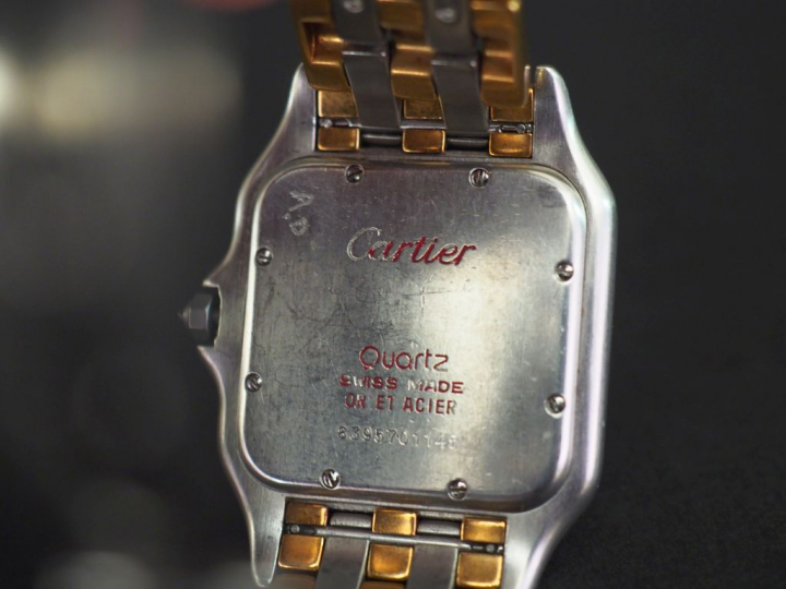 CARTIER.  Montre "Panthère", boîtier et bracelet en or jaune et acier.