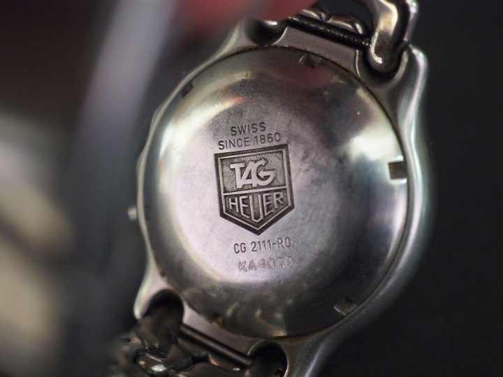 TAG HEUER, Automatic Montre bracelet d'homme en acier.  Boitier à lune