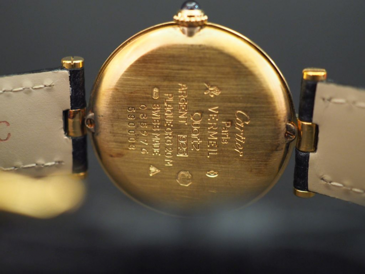 CARTIER, Must Montre bracelet en vermeil.  Cadran rond à chiffres roma