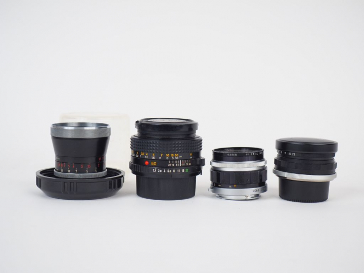 Lot de quatre objectifs :  - OLYMPUS F=38 mm/1:2,8 n°108700  - VOIGTLA