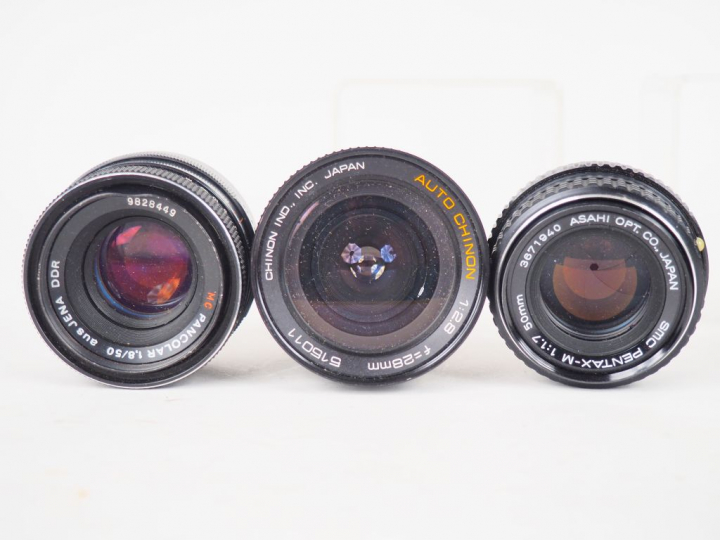 Lot de onze différents objectifs dont CANON, SIGMA, PENTAX, ISCO, PENT
