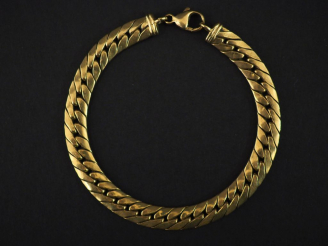 Vente aux enchères Bracelet souple en or jaune, maille plate gourmette.  Long. 20 cm Poid