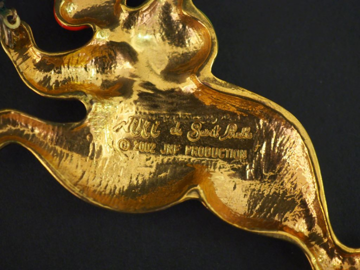 NIKI DE SAINT PHALLE,  Pendentif "Nana" en métal doré et émail polychr