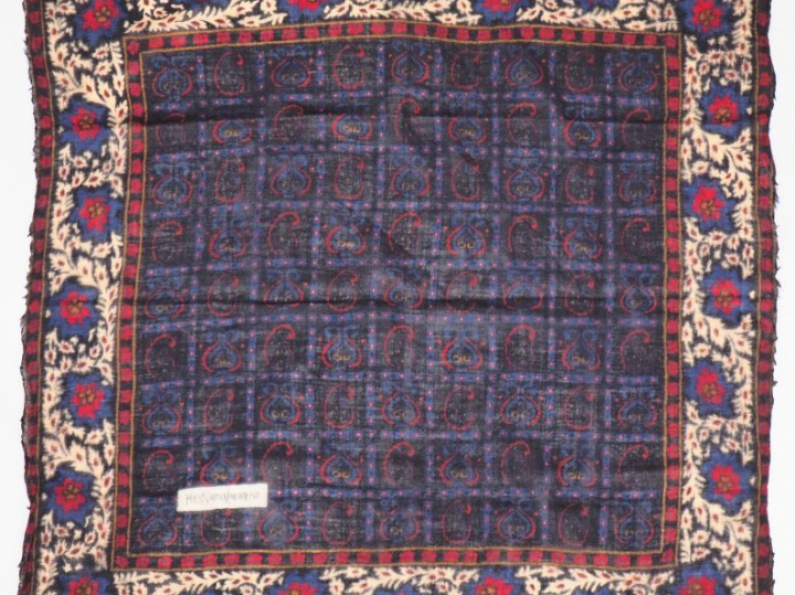 YVES SAINT LAURENT,  - un foulard probablement en soie, à décor de tri