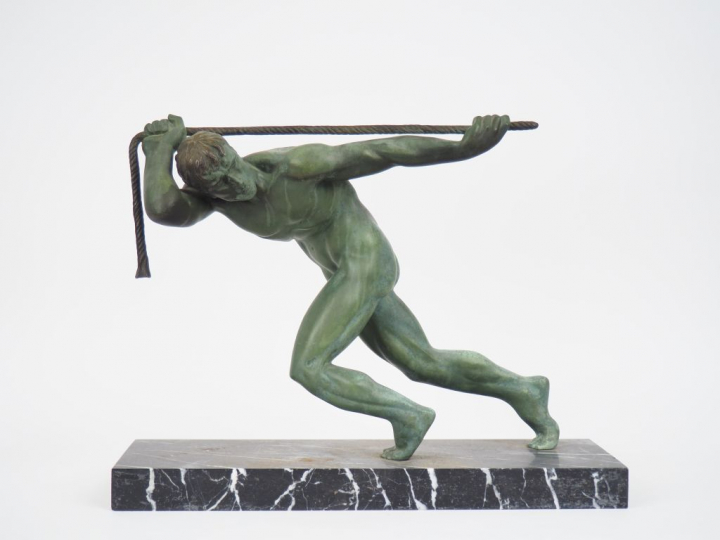 GUIRAUD-RIVIERE.  "La force". Sculpture en bronze à patine verte sur u
