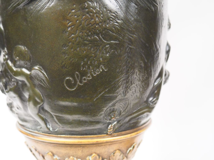 CLODION (d'après).  Paire d'aiguières en bronze patiné, à décor de mas