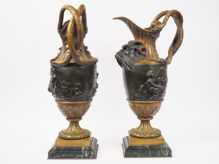 CLODION (d'après).  Paire d'aiguières en bronze patiné, à décor de mas