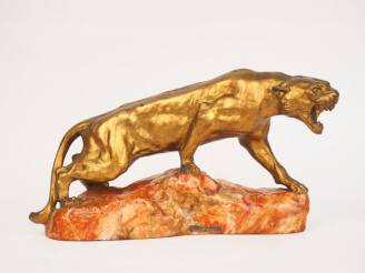 Vente aux enchères CARTIER.  "la lionne en furie" Sculpture en plâtre polychrome. Signée 