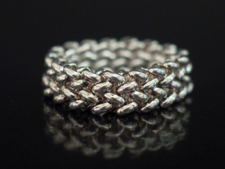 Vente aux enchères Bague bandeau en argent, maille souple grains de riz. TDD. 51 1/2  Poi