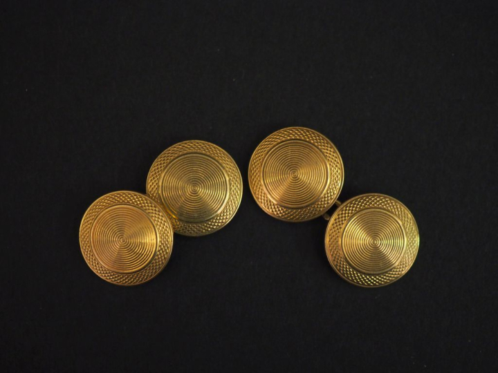 Paire de boutons de manchettes en or jaune 750, à décor de cercles con