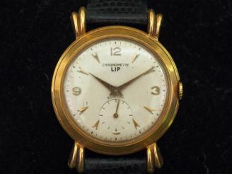 Vente aux enchères LIP, Elgiloy Montre bracelet, boitier en or jaune 750. Cadran rond à c