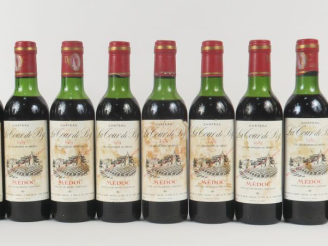 Vente aux enchères 11 BOUTEILLES (37,5 CL) CHÂTEAU LA TOUR DE BY CB MEDOC - 1979 - BG à M