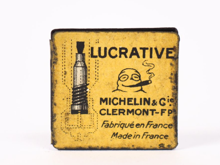 MICHELIN. Petite boîte en tôle lithographiée jaune, valve lucrative ci