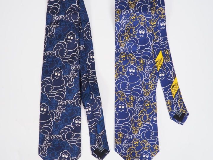 LONGCHAMP.  Deux cravates en soie à décor de Bibendum.
