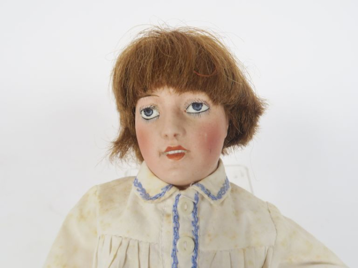 	Masson poupée à tête porcelaine marquée Lorraine 0 les yeux sont en i